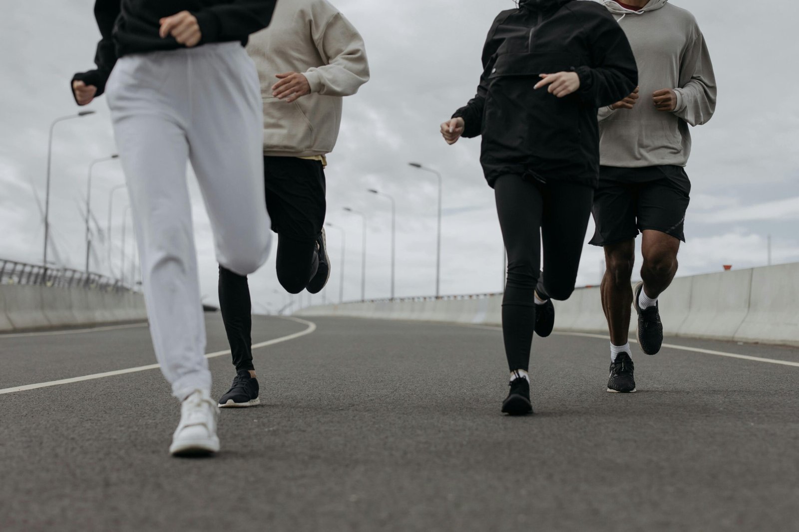 Men and women running in the city